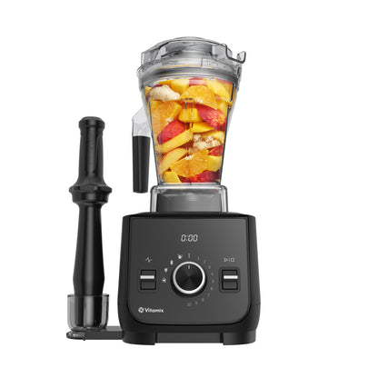 Ascent X2 Blender with fruit inside on a white background